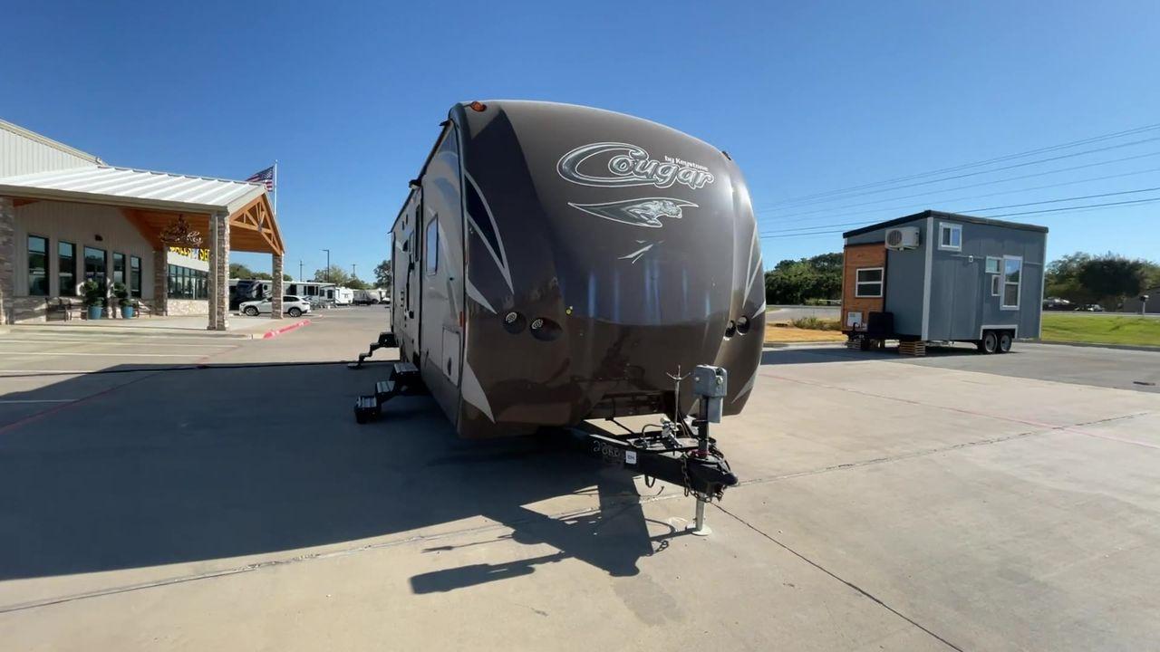 2016 BROWN KEYSTONE COUGAR 28RBS - (4YDT28R23GV) , Length: 32.17 ft. | Dry Weight: 6,115 lbs. | Gross Weight: 8,200 lbs. | Slides: 1 transmission, located at 4319 N Main St, Cleburne, TX, 76033, (817) 678-5133, 32.385960, -97.391212 - Photo #4