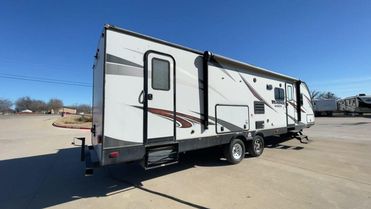 2018 GRAY HEARTLAND WILDERNESS USED 3125 (5SFNB3526JE) , Length: 35.75 ft. | Dry Weight: 6,840 lbs. | Gross Weight: 8,600 lbs. | Slides: 1 transmission, located at 4319 N Main St, Cleburne, TX, 76033, (817) 678-5133, 32.385960, -97.391212 - Discover your inner adventurer with the Heartland Wilderness 3125 travel trailer from 2018. This RV offers the ideal balance of roomy living, contemporary conveniences, and tough sturdiness for your outdoor adventures. It is designed for individuals who desire both comfort and exploration. The dimen - Photo #1