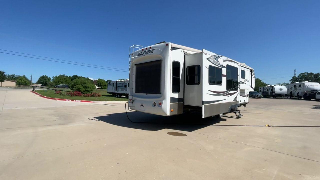 2013 WHITE KEYSTONE ALPNE 3720FB - (4YDF37227DE) , Length: 39.42 ft. | Dry Weight: 12,457 lbs. | Gross Weight: 15,500 lbs. | Slides: 4 transmission, located at 4319 N Main Street, Cleburne, TX, 76033, (817) 221-0660, 32.435829, -97.384178 - Explore more reasons that emphasize the benefits of having this RV as your own. (1) Its large living area features a slide-out with a sofa, recliner, and entertainment center with a fireplace and 32"" LCD TV. (2) It has U-shaped dinette with booth seating provides ample space for dining and ent - Photo #1