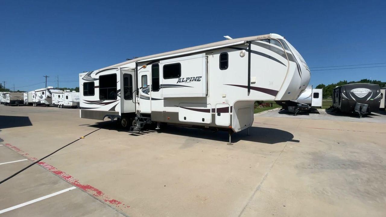 2013 WHITE KEYSTONE ALPNE 3720FB - (4YDF37227DE) , Length: 39.42 ft. | Dry Weight: 12,457 lbs. | Gross Weight: 15,500 lbs. | Slides: 4 transmission, located at 4319 N Main Street, Cleburne, TX, 76033, (817) 221-0660, 32.435829, -97.384178 - Explore more reasons that emphasize the benefits of having this RV as your own. (1) Its large living area features a slide-out with a sofa, recliner, and entertainment center with a fireplace and 32"" LCD TV. (2) It has U-shaped dinette with booth seating provides ample space for dining and ent - Photo #3
