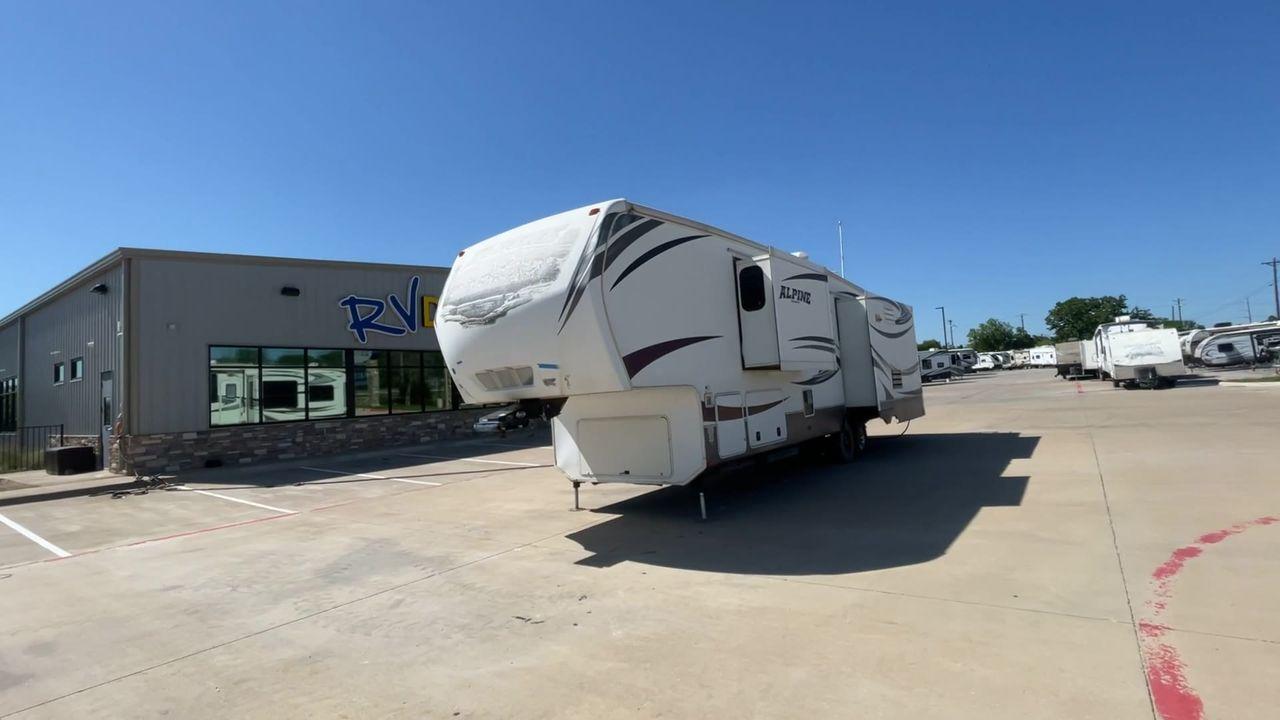 2013 WHITE KEYSTONE ALPNE 3720FB - (4YDF37227DE) , Length: 39.42 ft. | Dry Weight: 12,457 lbs. | Gross Weight: 15,500 lbs. | Slides: 4 transmission, located at 4319 N Main Street, Cleburne, TX, 76033, (817) 221-0660, 32.435829, -97.384178 - Explore more reasons that emphasize the benefits of having this RV as your own. (1) Its large living area features a slide-out with a sofa, recliner, and entertainment center with a fireplace and 32"" LCD TV. (2) It has U-shaped dinette with booth seating provides ample space for dining and ent - Photo #5