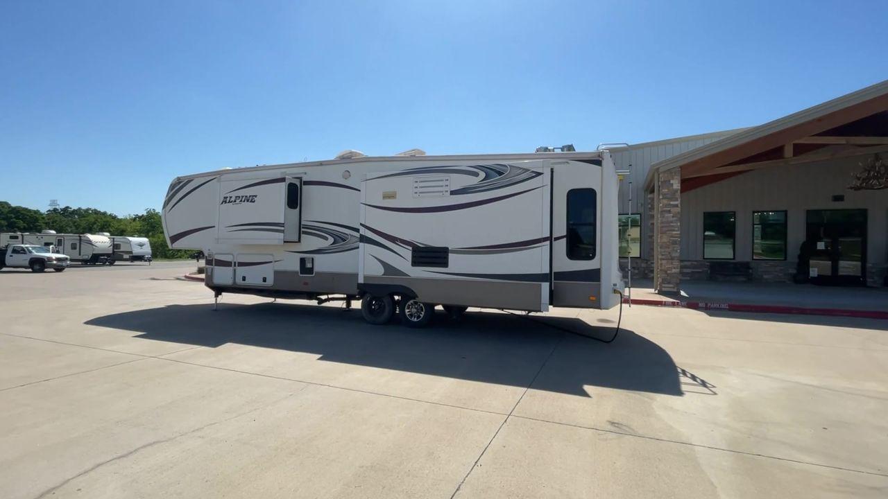 2013 WHITE KEYSTONE ALPNE 3720FB - (4YDF37227DE) , Length: 39.42 ft. | Dry Weight: 12,457 lbs. | Gross Weight: 15,500 lbs. | Slides: 4 transmission, located at 4319 N Main Street, Cleburne, TX, 76033, (817) 221-0660, 32.435829, -97.384178 - Explore more reasons that emphasize the benefits of having this RV as your own. (1) Its large living area features a slide-out with a sofa, recliner, and entertainment center with a fireplace and 32"" LCD TV. (2) It has U-shaped dinette with booth seating provides ample space for dining and ent - Photo #7