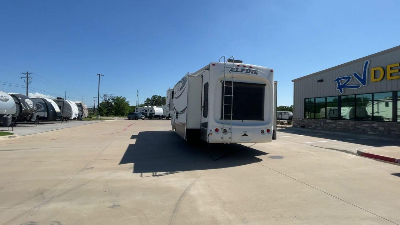 2013 WHITE KEYSTONE ALPNE 3720FB - (4YDF37227DE) , Length: 39.42 ft. | Dry Weight: 12,457 lbs. | Gross Weight: 15,500 lbs. | Slides: 4 transmission, located at 4319 N Main Street, Cleburne, TX, 76033, (817) 221-0660, 32.435829, -97.384178 - Explore more reasons that emphasize the benefits of having this RV as your own. (1) Its large living area features a slide-out with a sofa, recliner, and entertainment center with a fireplace and 32"" LCD TV. (2) It has U-shaped dinette with booth seating provides ample space for dining and ent - Photo #8