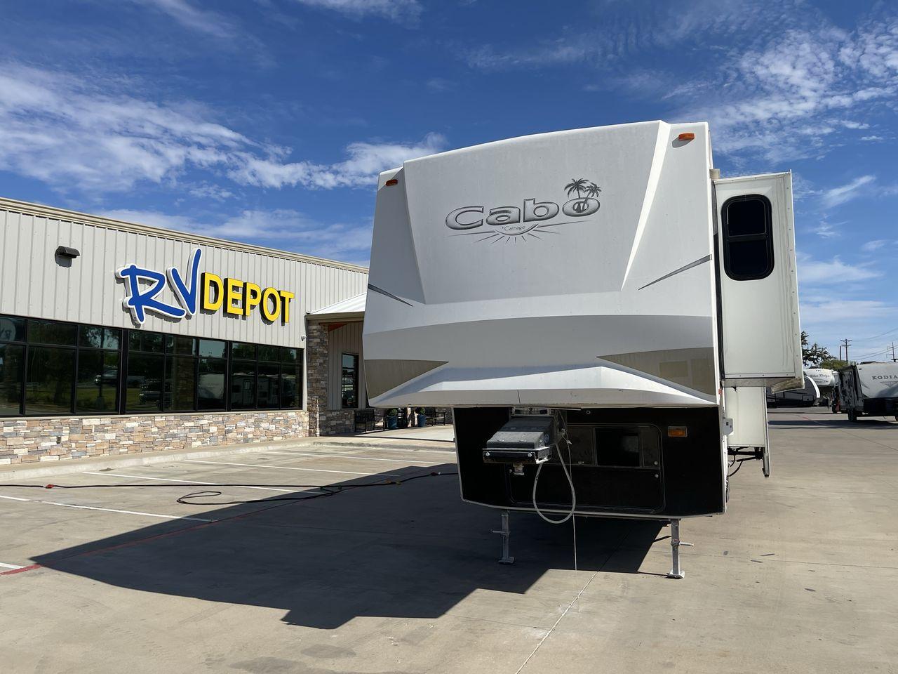 2011 WHITE CARRIAGE CABO 361 - (16F62G4R9B1) , Length: 36.92 ft. | Dry Weight: 11,275 lbs. | Slides: 3 transmission, located at 4319 N Main Street, Cleburne, TX, 76033, (817) 221-0660, 32.435829, -97.384178 - This 2011 Carriage Cabo 361 fifth wheel measures just under 37' in length. It is a dual axle setup with a dry weight of 11,275 lbs and a carrying capacity of 3,724 lbs. With three slides, this fifth wheel is spacious! The Columbus's exterior is made from fiberglass, finished in white with tan graphi - Photo #0