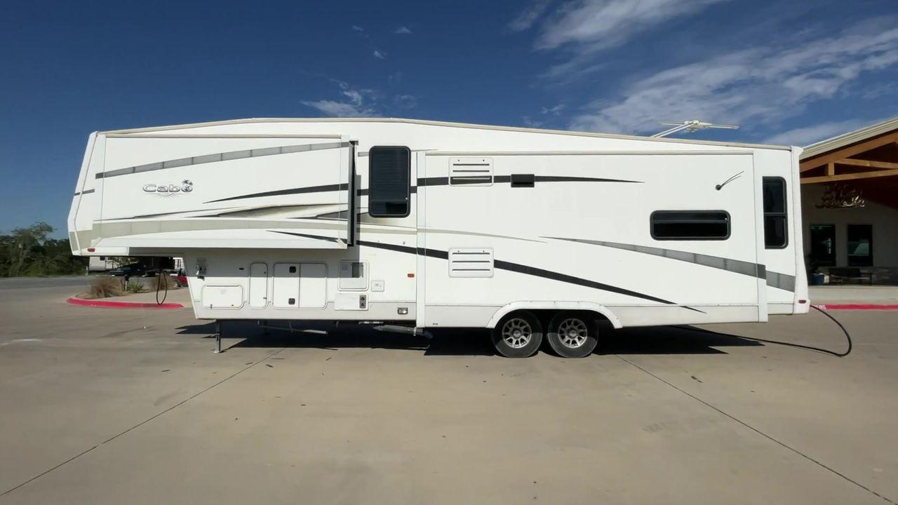 2011 WHITE CARRIAGE CABO 361 - (16F62G4R9B1) , Length: 36.92 ft. | Dry Weight: 11,275 lbs. | Slides: 3 transmission, located at 4319 N Main Street, Cleburne, TX, 76033, (817) 221-0660, 32.435829, -97.384178 - This 2011 Carriage Cabo 361 fifth wheel measures just under 37' in length. It is a dual axle setup with a dry weight of 11,275 lbs and a carrying capacity of 3,724 lbs. With three slides, this fifth wheel is spacious! The Columbus's exterior is made from fiberglass, finished in white with tan graphi - Photo #7