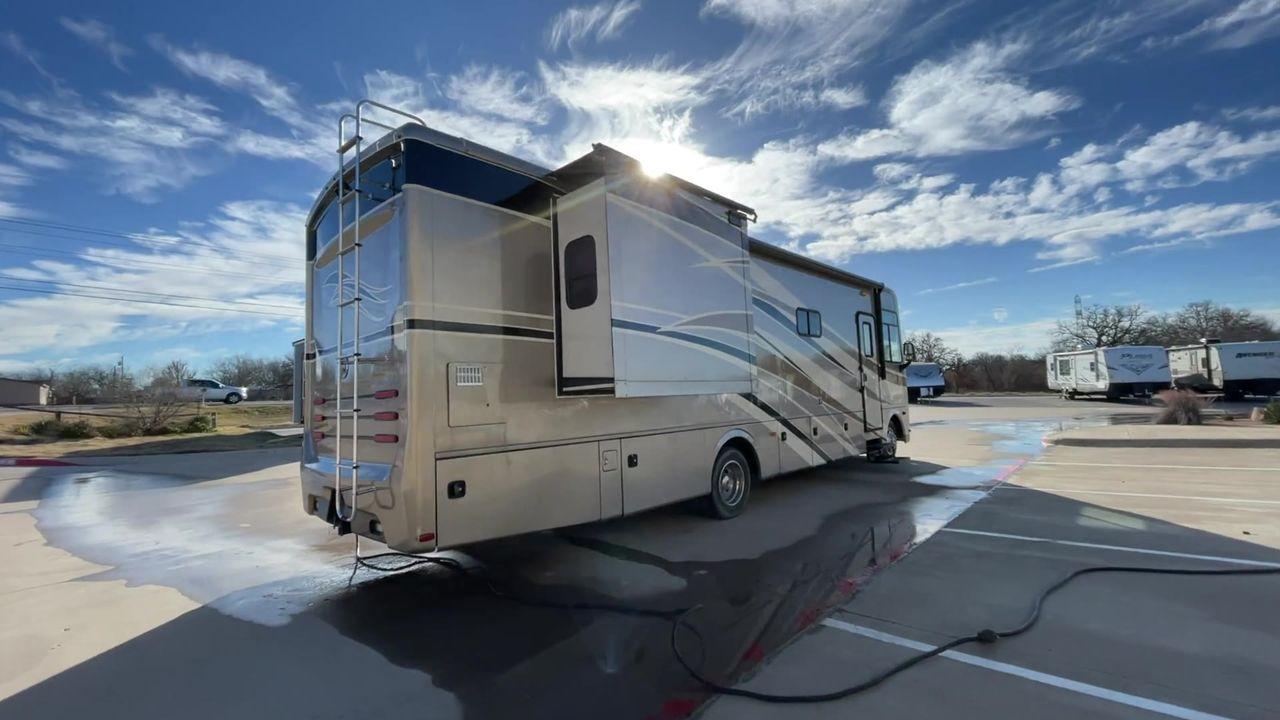 2014 BROWN HOLIDAY RAMBLER VACATIONER 33SFD - (1F66F5DY0D0) with an 6.8L V10 SOHC 30V engine, Length: 35 ft. | Slides: 2 transmission, located at 4319 N Main St, Cleburne, TX, 76033, (817) 678-5133, 32.385960, -97.391212 - The 2014 Holiday Rambler Vacationer 33SFD is a premium Class A motorhome that blends comfort and style for an unparalleled travel experience. This meticulously designed model is built on a Ford F53 chassis, powered by a robust Triton V10 engine to ensure a smooth and powerful ride. The Vacationer 33 - Photo #1