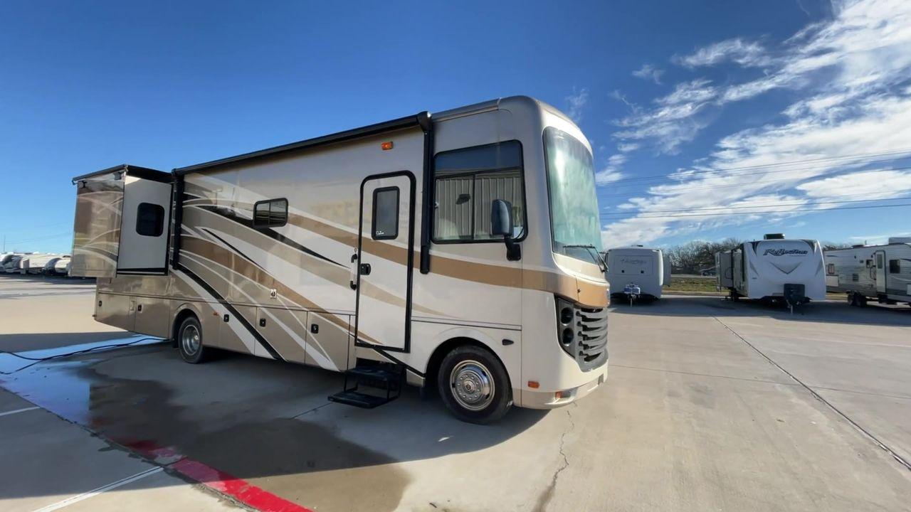 2014 BROWN HOLIDAY RAMBLER VACATIONER 33SFD - (1F66F5DY0D0) with an 6.8L V10 SOHC 30V engine, Length: 35 ft. | Slides: 2 transmission, located at 4319 N Main St, Cleburne, TX, 76033, (817) 678-5133, 32.385960, -97.391212 - The 2014 Holiday Rambler Vacationer 33SFD is a premium Class A motorhome that blends comfort and style for an unparalleled travel experience. This meticulously designed model is built on a Ford F53 chassis, powered by a robust Triton V10 engine to ensure a smooth and powerful ride. The Vacationer 33 - Photo #3
