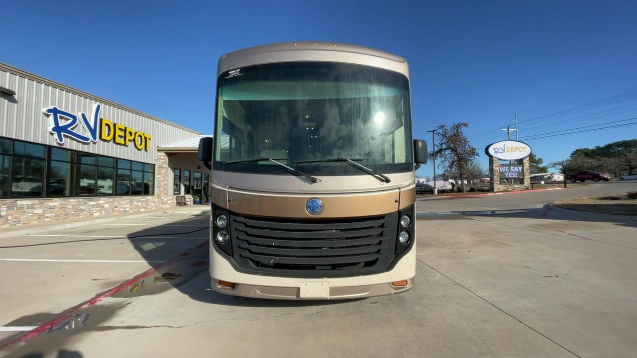 2014 BROWN HOLIDAY RAMBLER VACATIONER 33SFD - (1F66F5DY0D0) with an 6.8L V10 SOHC 30V engine, Length: 35 ft. | Slides: 2 transmission, located at 4319 N Main St, Cleburne, TX, 76033, (817) 678-5133, 32.385960, -97.391212 - The 2014 Holiday Rambler Vacationer 33SFD is a premium Class A motorhome that blends comfort and style for an unparalleled travel experience. This meticulously designed model is built on a Ford F53 chassis, powered by a robust Triton V10 engine to ensure a smooth and powerful ride. The Vacationer 33 - Photo #4