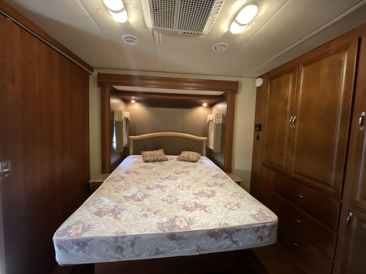 2014 BROWN HOLIDAY RAMBLER VACATIONER 33SFD - (1F66F5DY0D0) with an 6.8L V10 SOHC 30V engine, Length: 35 ft. | Slides: 2 transmission, located at 4319 N Main St, Cleburne, TX, 76033, (817) 678-5133, 32.385960, -97.391212 - The 2013 Holiday Rambler Vacationer 33SFD gives you the comfort and convenience of a residential home. The cockpit comes with a flat-screen TV above with lots of storage space. There is a comfy hide-a-bed sofa in the living area to have a comfortable view of the TV. Beside the couch is a free-standi - Photo #17