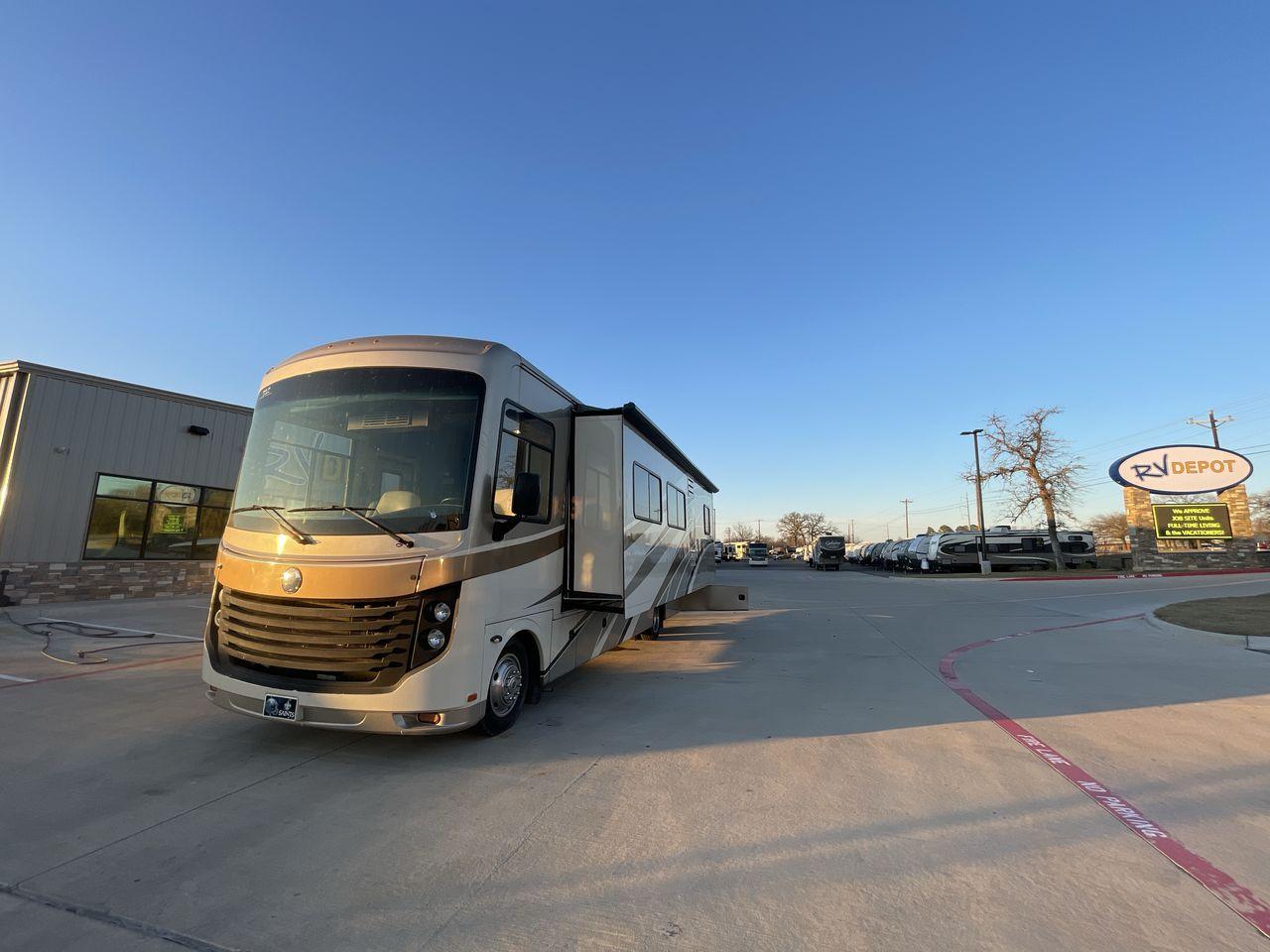 2014 BROWN HOLIDAY RAMBLER VACATIONER 33SFD - (1F66F5DY0D0) with an 6.8L V10 SOHC 30V engine, Length: 35 ft. | Slides: 2 transmission, located at 4319 N Main St, Cleburne, TX, 76033, (817) 678-5133, 32.385960, -97.391212 - The 2013 Holiday Rambler Vacationer 33SFD gives you the comfort and convenience of a residential home. The cockpit comes with a flat-screen TV above with lots of storage space. There is a comfy hide-a-bed sofa in the living area to have a comfortable view of the TV. Beside the couch is a free-standi - Photo #22