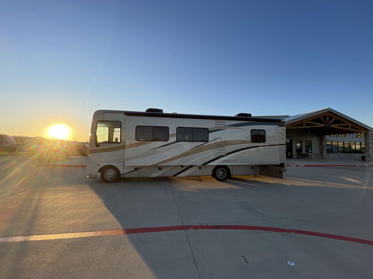 2014 BROWN HOLIDAY RAMBLER VACATIONER 33SFD - (1F66F5DY0D0) with an 6.8L V10 SOHC 30V engine, Length: 35 ft. | Slides: 2 transmission, located at 4319 N Main St, Cleburne, TX, 76033, (817) 678-5133, 32.385960, -97.391212 - The 2013 Holiday Rambler Vacationer 33SFD gives you the comfort and convenience of a residential home. The cockpit comes with a flat-screen TV above with lots of storage space. There is a comfy hide-a-bed sofa in the living area to have a comfortable view of the TV. Beside the couch is a free-standi - Photo #23