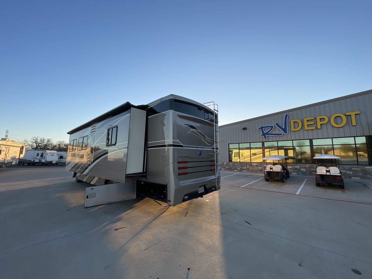 2014 BROWN HOLIDAY RAMBLER VACATIONER 33SFD - (1F66F5DY0D0) with an 6.8L V10 SOHC 30V engine, Length: 35 ft. | Slides: 2 transmission, located at 4319 N Main St, Cleburne, TX, 76033, (817) 678-5133, 32.385960, -97.391212 - The 2013 Holiday Rambler Vacationer 33SFD gives you the comfort and convenience of a residential home. The cockpit comes with a flat-screen TV above with lots of storage space. There is a comfy hide-a-bed sofa in the living area to have a comfortable view of the TV. Beside the couch is a free-standi - Photo #24