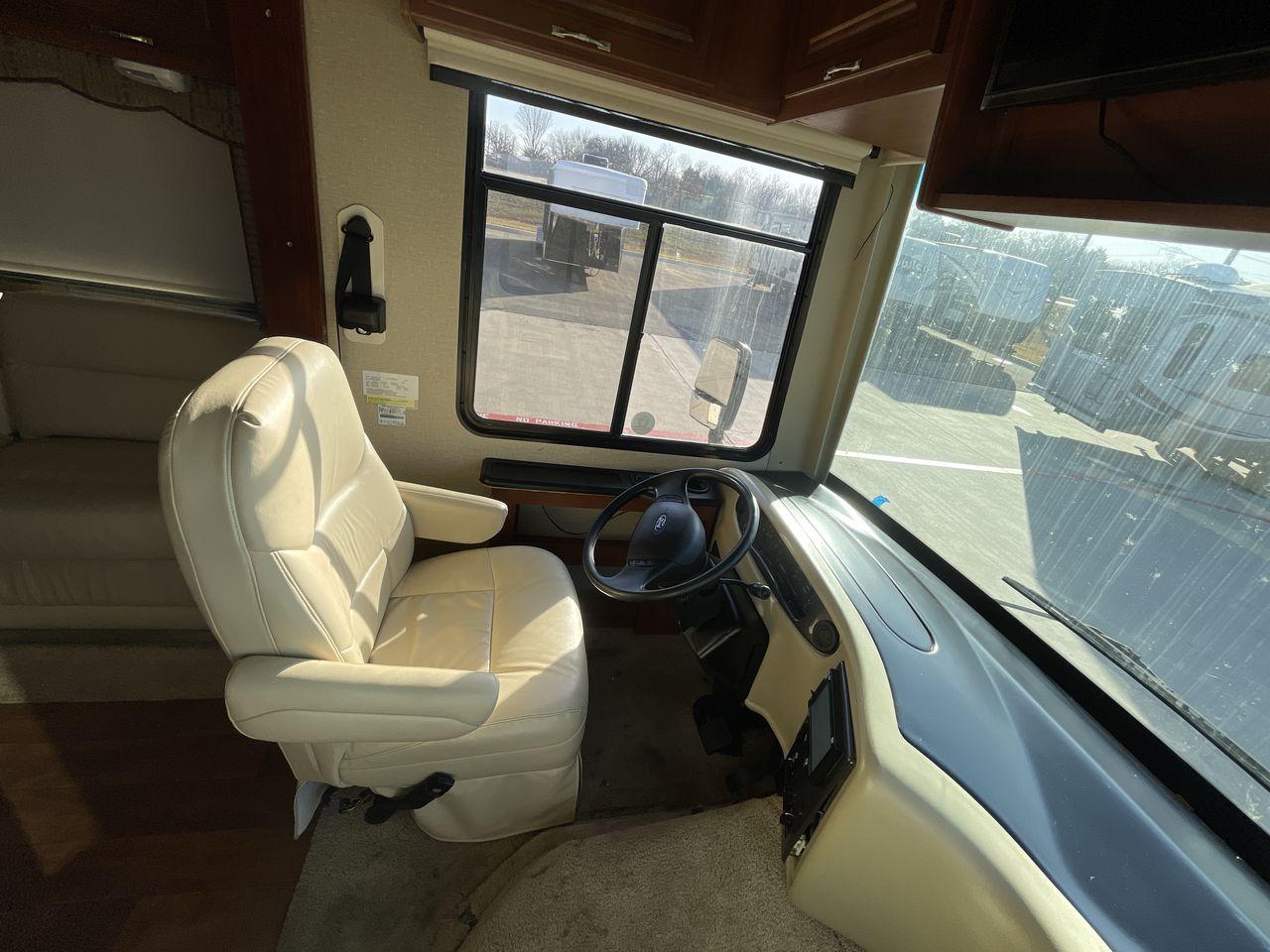 2014 BROWN HOLIDAY RAMBLER VACATIONER 33SFD - (1F66F5DY0D0) with an 6.8L V10 SOHC 30V engine, Length: 35 ft. | Slides: 2 transmission, located at 4319 N Main St, Cleburne, TX, 76033, (817) 678-5133, 32.385960, -97.391212 - The 2013 Holiday Rambler Vacationer 33SFD gives you the comfort and convenience of a residential home. The cockpit comes with a flat-screen TV above with lots of storage space. There is a comfy hide-a-bed sofa in the living area to have a comfortable view of the TV. Beside the couch is a free-standi - Photo #28