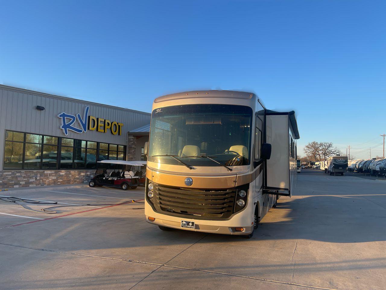 2014 BROWN HOLIDAY RAMBLER VACATIONER 33SFD - (1F66F5DY0D0) with an 6.8L V10 SOHC 30V engine, Length: 35 ft. | Slides: 2 transmission, located at 4319 N Main St, Cleburne, TX, 76033, (817) 678-5133, 32.385960, -97.391212 - The 2013 Holiday Rambler Vacationer 33SFD gives you the comfort and convenience of a residential home. The cockpit comes with a flat-screen TV above with lots of storage space. There is a comfy hide-a-bed sofa in the living area to have a comfortable view of the TV. Beside the couch is a free-standi - Photo #32