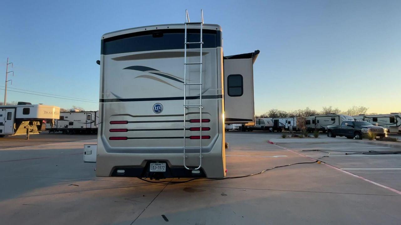 2014 BROWN HOLIDAY RAMBLER VACATIONER 33SFD - (1F66F5DY0D0) with an 6.8L V10 SOHC 30V engine, Length: 35 ft. | Slides: 2 transmission, located at 4319 N Main St, Cleburne, TX, 76033, (817) 678-5133, 32.385960, -97.391212 - The 2013 Holiday Rambler Vacationer 33SFD gives you the comfort and convenience of a residential home. The cockpit comes with a flat-screen TV above with lots of storage space. There is a comfy hide-a-bed sofa in the living area to have a comfortable view of the TV. Beside the couch is a free-standi - Photo #2