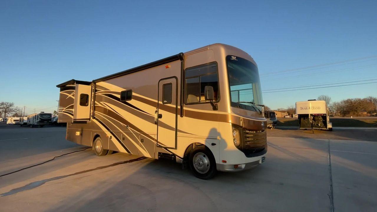 2014 BROWN HOLIDAY RAMBLER VACATIONER 33SFD - (1F66F5DY0D0) with an 6.8L V10 SOHC 30V engine, Length: 35 ft. | Slides: 2 transmission, located at 4319 N Main St, Cleburne, TX, 76033, (817) 678-5133, 32.385960, -97.391212 - The 2013 Holiday Rambler Vacationer 33SFD gives you the comfort and convenience of a residential home. The cockpit comes with a flat-screen TV above with lots of storage space. There is a comfy hide-a-bed sofa in the living area to have a comfortable view of the TV. Beside the couch is a free-standi - Photo #6