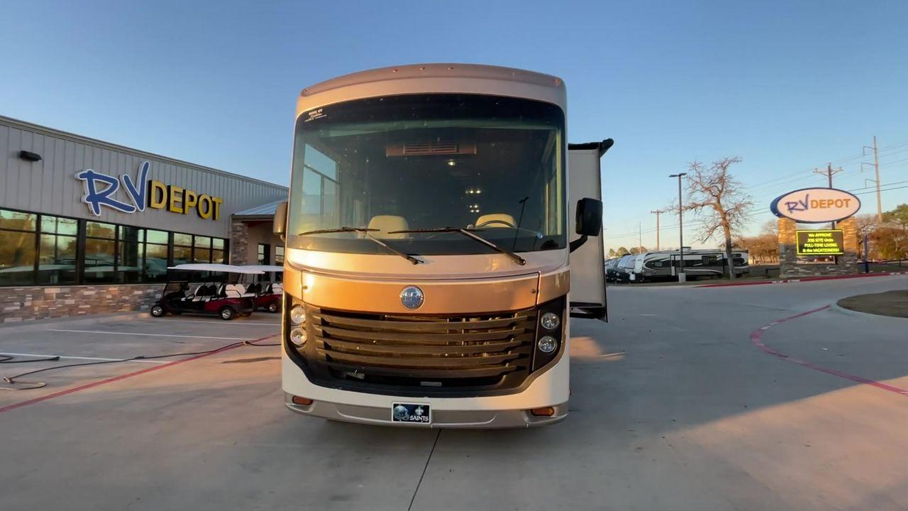 2014 BROWN HOLIDAY RAMBLER VACATIONER 33SFD - (1F66F5DY0D0) with an 6.8L V10 SOHC 30V engine, Length: 35 ft. | Slides: 2 transmission, located at 4319 N Main St, Cleburne, TX, 76033, (817) 678-5133, 32.385960, -97.391212 - The 2013 Holiday Rambler Vacationer 33SFD gives you the comfort and convenience of a residential home. The cockpit comes with a flat-screen TV above with lots of storage space. There is a comfy hide-a-bed sofa in the living area to have a comfortable view of the TV. Beside the couch is a free-standi - Photo #7