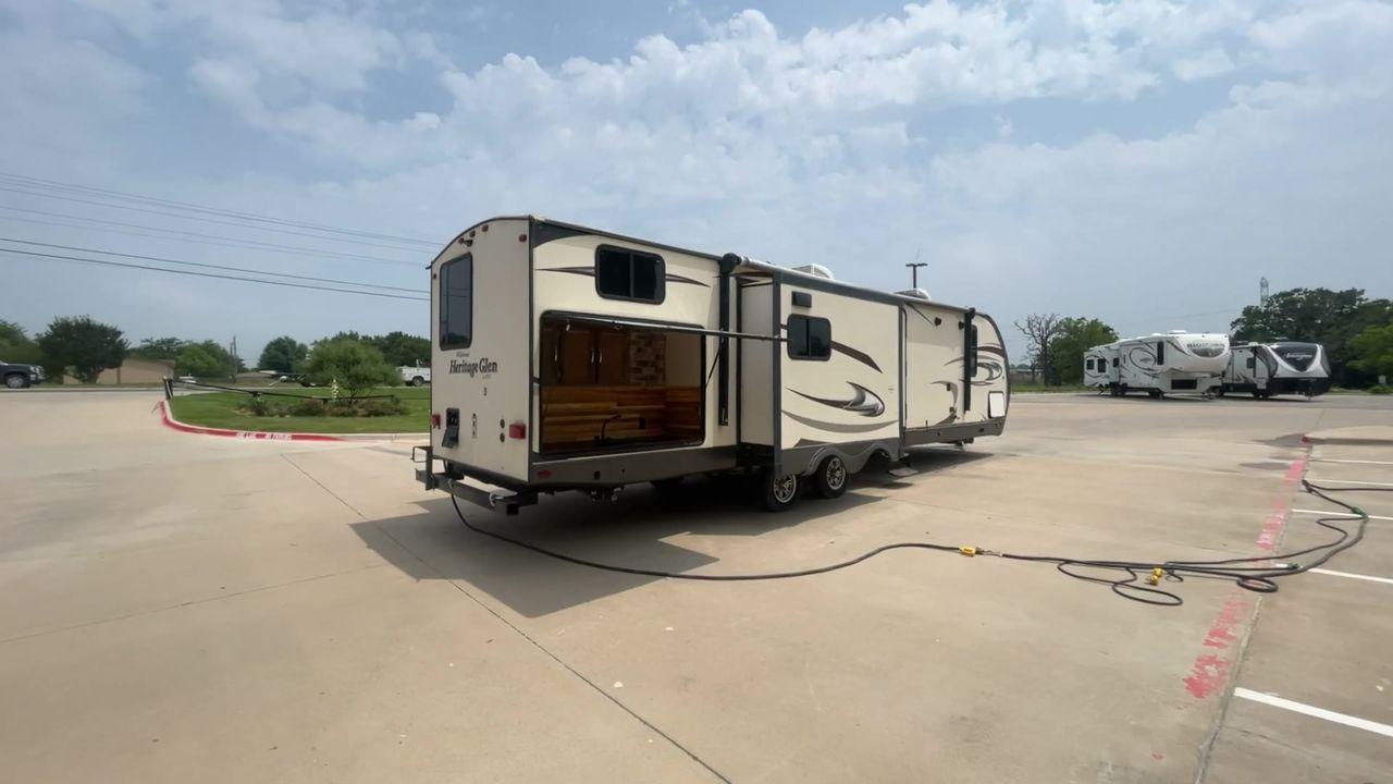 2017 TAN WILDWOOD HERITAGE GLEN 300BH (4X4TWBF29HU) , Length: 37.42 ft. | Dry Weight: 8,439 lbs. | Slides: 3 transmission, located at 4319 N Main Street, Cleburne, TX, 76033, (817) 221-0660, 32.435829, -97.384178 - The 2017 Wildwood Heritage Glen 300BH has roomy and comfortable rooms for your outdoor activities. This travel trailer offers ample space for the entire family, measuring 37.42 feet in length and weighing 8,439 pounds when dry. This trailer is designed with three slides, providing ample interior spa - Photo #1