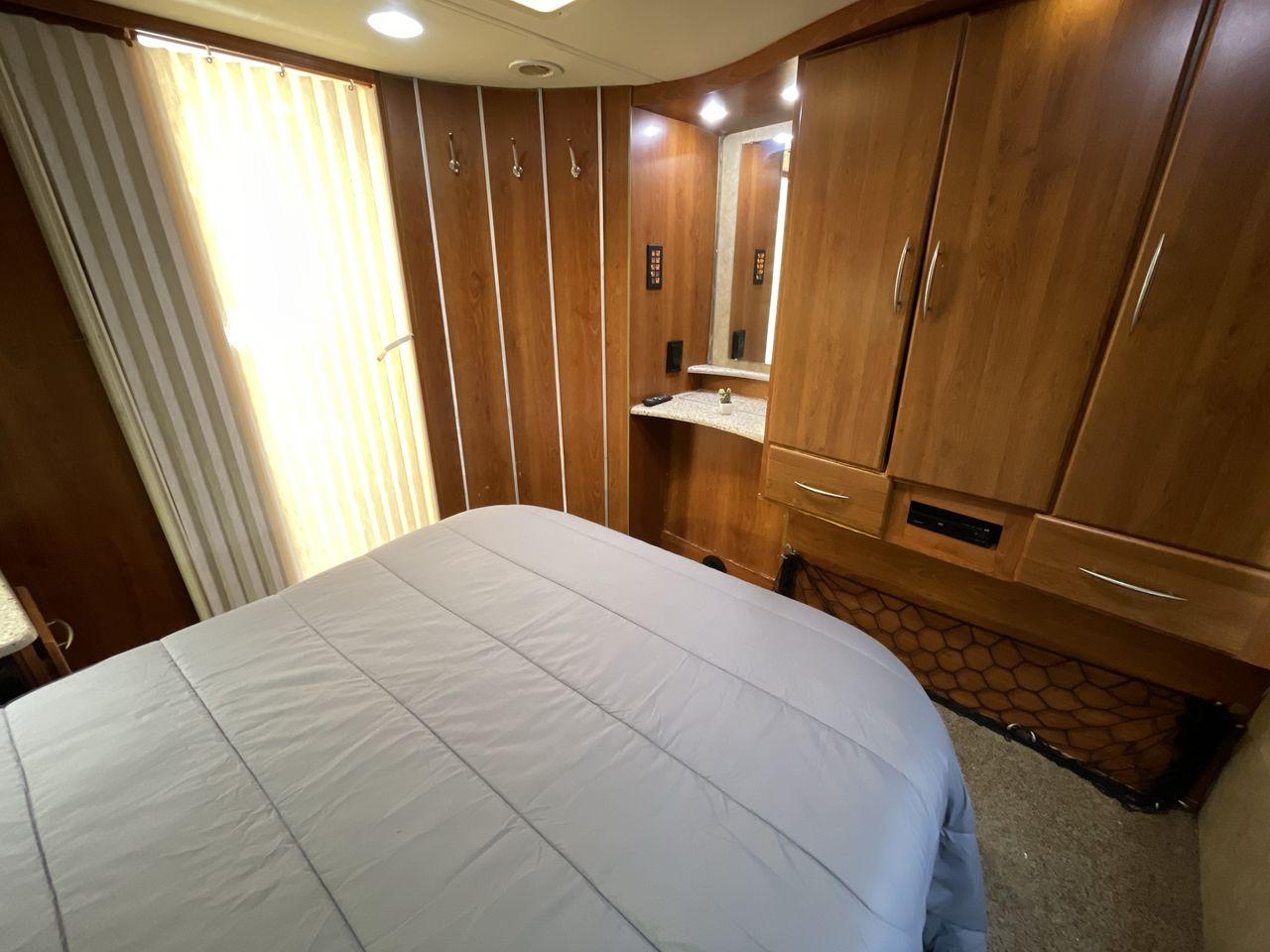 2008 TAN COACHMEN LEPRECHAUN 320DS E-450 (1FDXE45S08D) with an 6.8L V10 SOHC 20V engine, Length: 31.5 ft. | Dry Weight: 12,555 lbs. | Gross Weight: 14,500 lbs. | Slides: 2 transmission, located at 4319 N Main St, Cleburne, TX, 76033, (817) 678-5133, 32.385960, -97.391212 - Here are some unique features and characteristics of the 2008 Coachmen Leprechaun 320DS that will make you want to buy this motorhome. (1) The 2008 Coachmen Leprechaun 320DS has two slide-outs, which expand the living space to create more room for relaxation and entertainment. With these additional - Photo #17