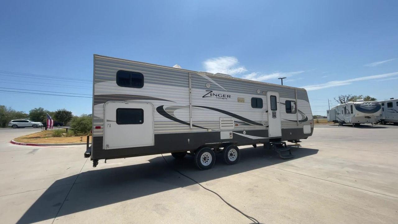 2014 GOLD CROSSROADS ZINGER 320QB (4V0TC3226EJ) , Length: 33.83 ft. | Dry Weight: 5,796 lbs. | Slides: 1 transmission, located at 4319 N Main St, Cleburne, TX, 76033, (817) 678-5133, 32.385960, -97.391212 - Photo #1