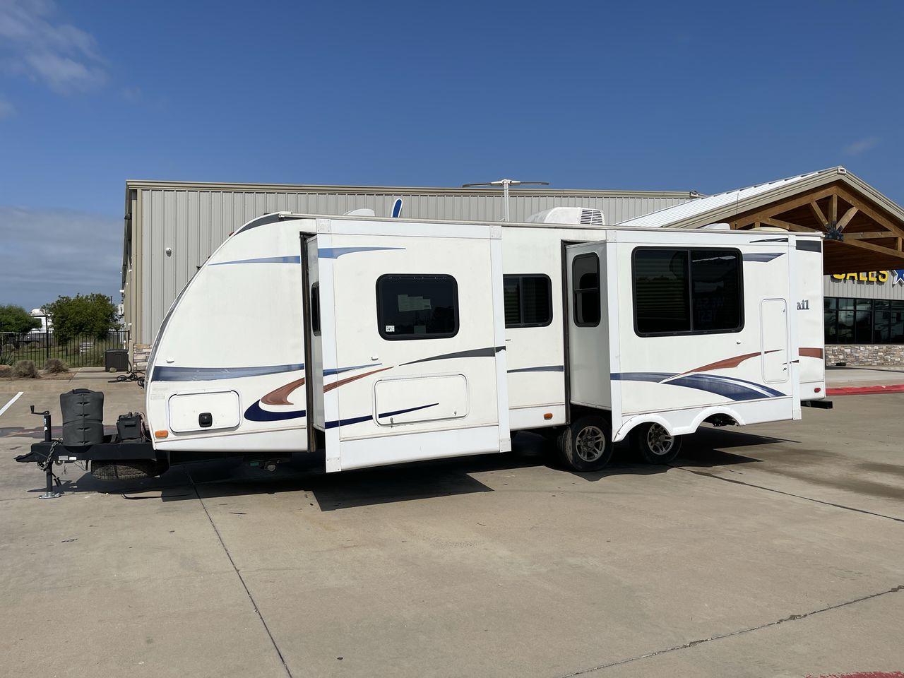 2011 WHITE HEARTLAND NORTH TRAIL 26B (5SFNB3225BE) , Length: 32.5 ft. | Dry Weight: 7,104 lbs. | Gross Weight: 8,600 lbs. | Slides: 2 transmission, located at 4319 N Main Street, Cleburne, TX, 76033, (817) 221-0660, 32.435829, -97.384178 - Enjoy a spontaneous weekend getaway in this 2011 Heartland North Trail 26BRSS Travel Trailer! It is a dual-axle steel wheel setup measuring 32.5 ft. in length and 10.83 ft. in height. It has a dry weight of 7,104 lbs. and a GVWR of 8,600 lbs. It is equipped with automatic heating and cooling rated a - Photo #22