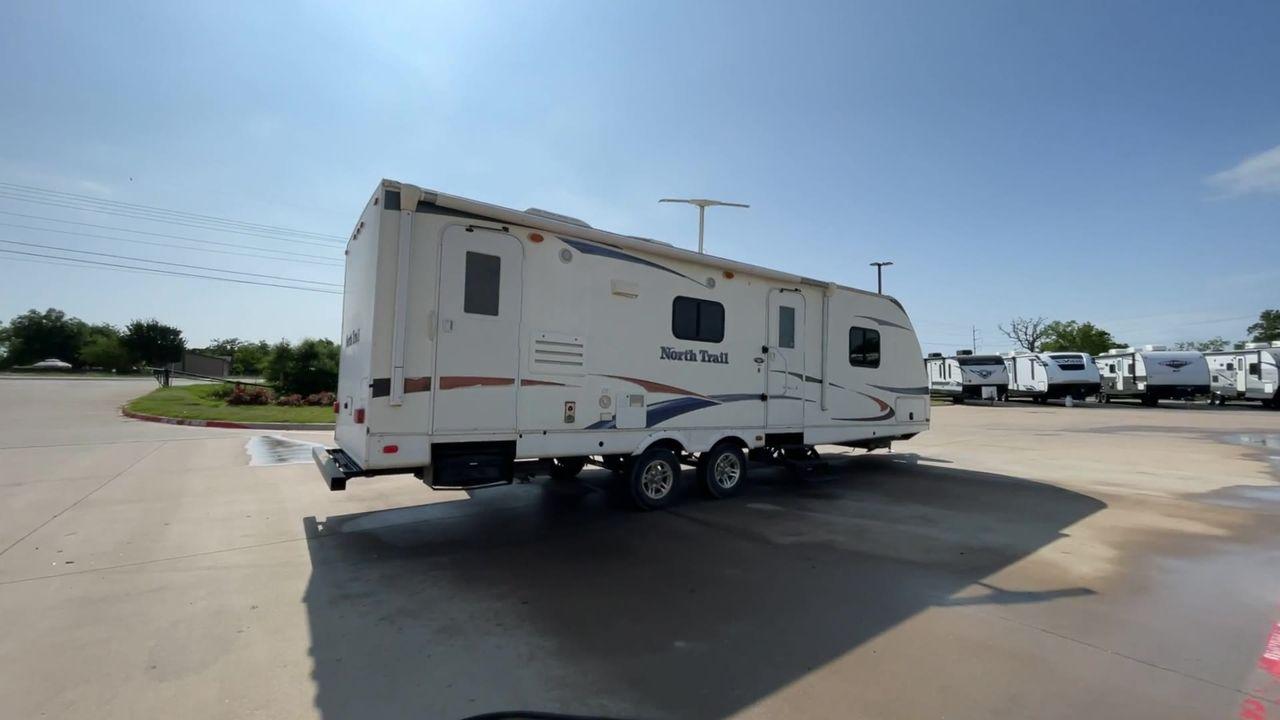 2011 WHITE HEARTLAND NORTH TRAIL 26B (5SFNB3225BE) , Length: 32.5 ft. | Dry Weight: 7,104 lbs. | Gross Weight: 8,600 lbs. | Slides: 2 transmission, located at 4319 N Main Street, Cleburne, TX, 76033, (817) 221-0660, 32.435829, -97.384178 - Enjoy a spontaneous weekend getaway in this 2011 Heartland North Trail 26BRSS Travel Trailer! It is a dual-axle steel wheel setup measuring 32.5 ft. in length and 10.83 ft. in height. It has a dry weight of 7,104 lbs. and a GVWR of 8,600 lbs. It is equipped with automatic heating and cooling rated a - Photo #1