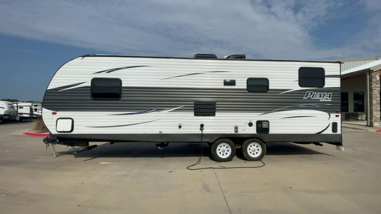 2016 GRAY PUMA XLE CANYON CAT 25FBC - (4X4TPUA2XGP) , Length: 29.58 ft.| Dry Weight: 5,390 lbs. | Gross Weight: 7,775 lbs. | Slides: 0 transmission, located at 4319 N Main Street, Cleburne, TX, 76033, (817) 221-0660, 32.435829, -97.384178 - The 2016 Puma XLE Canyon Cat 25FBC, measuring 28 feet length and 8 feet in width, epitomizes Palomino RV's dedication to delivering a compact yet functional travel experience. It offers a balance between size and towing efficiency. The construction features a powder-coated steel I-beam frame, alumin - Photo #2