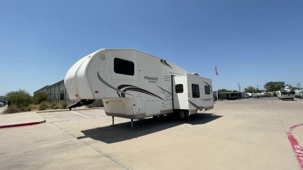 2010 WHITE FLAGSTAFF 8528CKSS - (4X4FFLD20A1) , Length: 30 ft. | Dry Weight: 6,877 lbs. | Slides: 2 transmission, located at 4319 N Main St, Cleburne, TX, 76033, (817) 678-5133, 32.385960, -97.391212 - The 2010 Flagstaff 8528CKSS CT is a well-crafted and compact travel trailer designed for comfort and convenience on the road. With a length of 30 feet 11 inches, a width of 8 feet, and a height of 12 feet 7 inches, this trailer offers a balance of space and maneuverability. Its thoughtful constructi - Photo #5