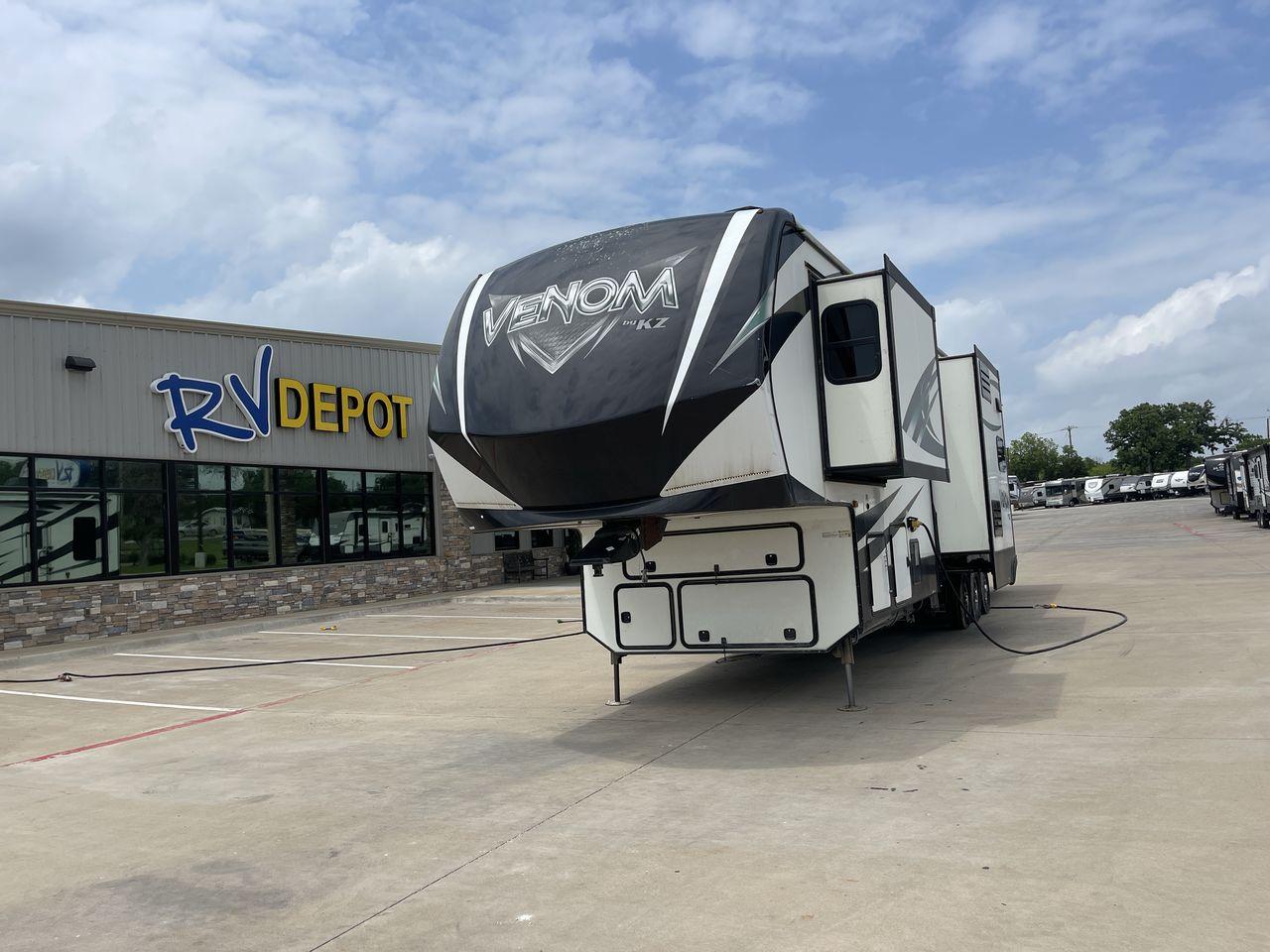 2017 BLACK VENOM 4013TK - (4EZFH4039H6) , Length: 43.33 ft. | Dry Weight: 14,760 lbs. | Gross Weight: 19,000 lbs. | Slides: 3 transmission, located at 4319 N Main Street, Cleburne, TX, 76033, (817) 221-0660, 32.435829, -97.384178 - With the 2017 Venom 4013TK, you can enjoy the highest level of luxury and usefulness. This impressive fifth wheel is 43.33 feet long, so it has plenty of room for your living space and storage for all your camping stuff. It is the right mix of strength and ease of towing, with a dry weight of 14,760 - Photo #0