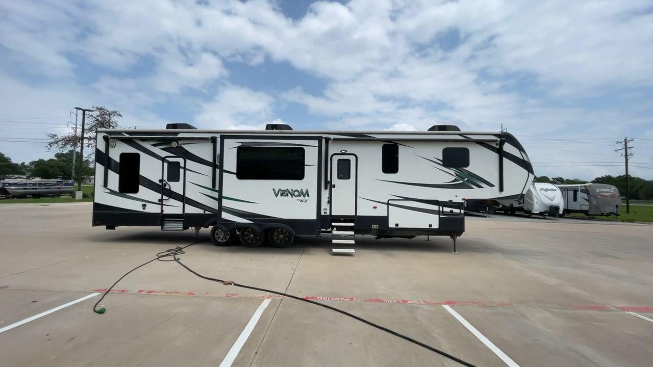 2017 BLACK VENOM 4013TK - (4EZFH4039H6) , Length: 43.33 ft. | Dry Weight: 14,760 lbs. | Gross Weight: 19,000 lbs. | Slides: 3 transmission, located at 4319 N Main Street, Cleburne, TX, 76033, (817) 221-0660, 32.435829, -97.384178 - With the 2017 Venom 4013TK, you can enjoy the highest level of luxury and usefulness. This impressive fifth wheel is 43.33 feet long, so it has plenty of room for your living space and storage for all your camping stuff. It is the right mix of strength and ease of towing, with a dry weight of 14,760 - Photo #2