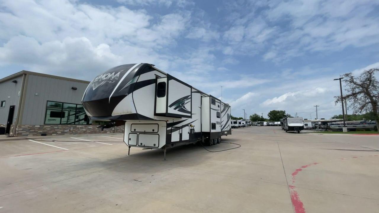 2017 BLACK VENOM 4013TK - (4EZFH4039H6) , Length: 43.33 ft. | Dry Weight: 14,760 lbs. | Gross Weight: 19,000 lbs. | Slides: 3 transmission, located at 4319 N Main Street, Cleburne, TX, 76033, (817) 221-0660, 32.435829, -97.384178 - With the 2017 Venom 4013TK, you can enjoy the highest level of luxury and usefulness. This impressive fifth wheel is 43.33 feet long, so it has plenty of room for your living space and storage for all your camping stuff. It is the right mix of strength and ease of towing, with a dry weight of 14,760 - Photo #5
