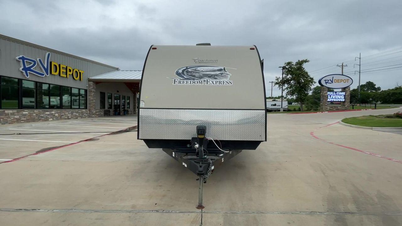 2015 TAN FREEDOM EXPRESS 305RKDS (5ZT2FEWB1FA) , Length: 34.5 ft. | Dry Weight: 6,199 lbs | Gross Weight: 9,500 lbs. | Slides: 2 transmission, located at 4319 N Main Street, Cleburne, TX, 76033, (817) 221-0660, 32.435829, -97.384178 - The 2015 Freedom Express 305RKDS is a travel trailer designed to deliver an exceptional camping experience, combining freedom and comfort in every detail. It boasts a rear kitchen layout, providing a unique and functional living space. The rear kitchen is equipped with high-end appliances, ample cou - Photo #4