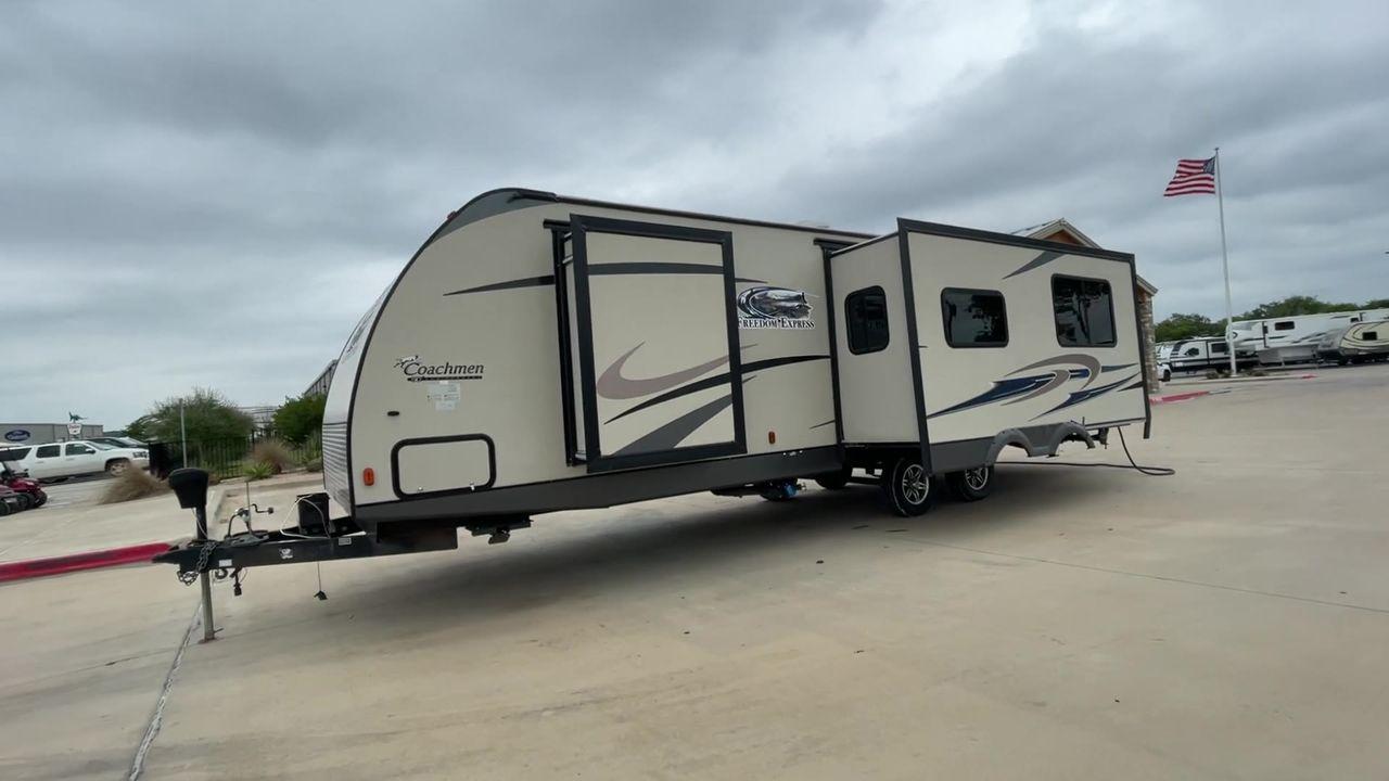 2015 TAN FREEDOM EXPRESS 305RKDS (5ZT2FEWB1FA) , Length: 34.5 ft. | Dry Weight: 6,199 lbs | Gross Weight: 9,500 lbs. | Slides: 2 transmission, located at 4319 N Main Street, Cleburne, TX, 76033, (817) 221-0660, 32.435829, -97.384178 - The 2015 Freedom Express 305RKDS is a travel trailer designed to deliver an exceptional camping experience, combining freedom and comfort in every detail. It boasts a rear kitchen layout, providing a unique and functional living space. The rear kitchen is equipped with high-end appliances, ample cou - Photo #5