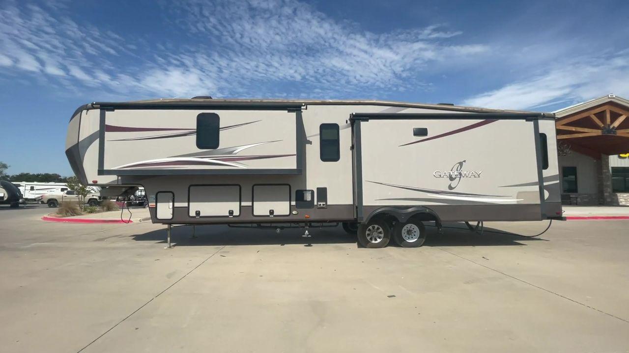 2015 BROWN HEARTLAND GATEWAY 3900SE (5SFSG4122FE) , Slides: 4 transmission, located at 4319 N Main St, Cleburne, TX, 76033, (817) 678-5133, 32.385960, -97.391212 - The 2015 Heartland Gateway 3900SE is a luxurious and spacious fifth-wheel RV designed for comfort and extended camping adventures. Measuring 41 feet in length and 8 feet in width, this RV offers ample space and a striking exterior. Constructed with a strong and lightweight aluminum frame, and fiberg - Photo #6