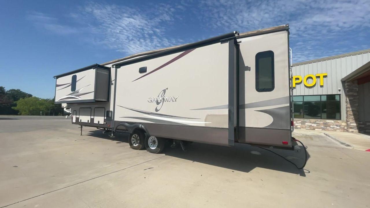 2015 BROWN HEARTLAND GATEWAY 3900SE (5SFSG4122FE) , Slides: 4 transmission, located at 4319 N Main St, Cleburne, TX, 76033, (817) 678-5133, 32.385960, -97.391212 - The 2015 Heartland Gateway 3900SE is a luxurious and spacious fifth-wheel RV designed for comfort and extended camping adventures. Measuring 41 feet in length and 8 feet in width, this RV offers ample space and a striking exterior. Constructed with a strong and lightweight aluminum frame, and fiberg - Photo #7