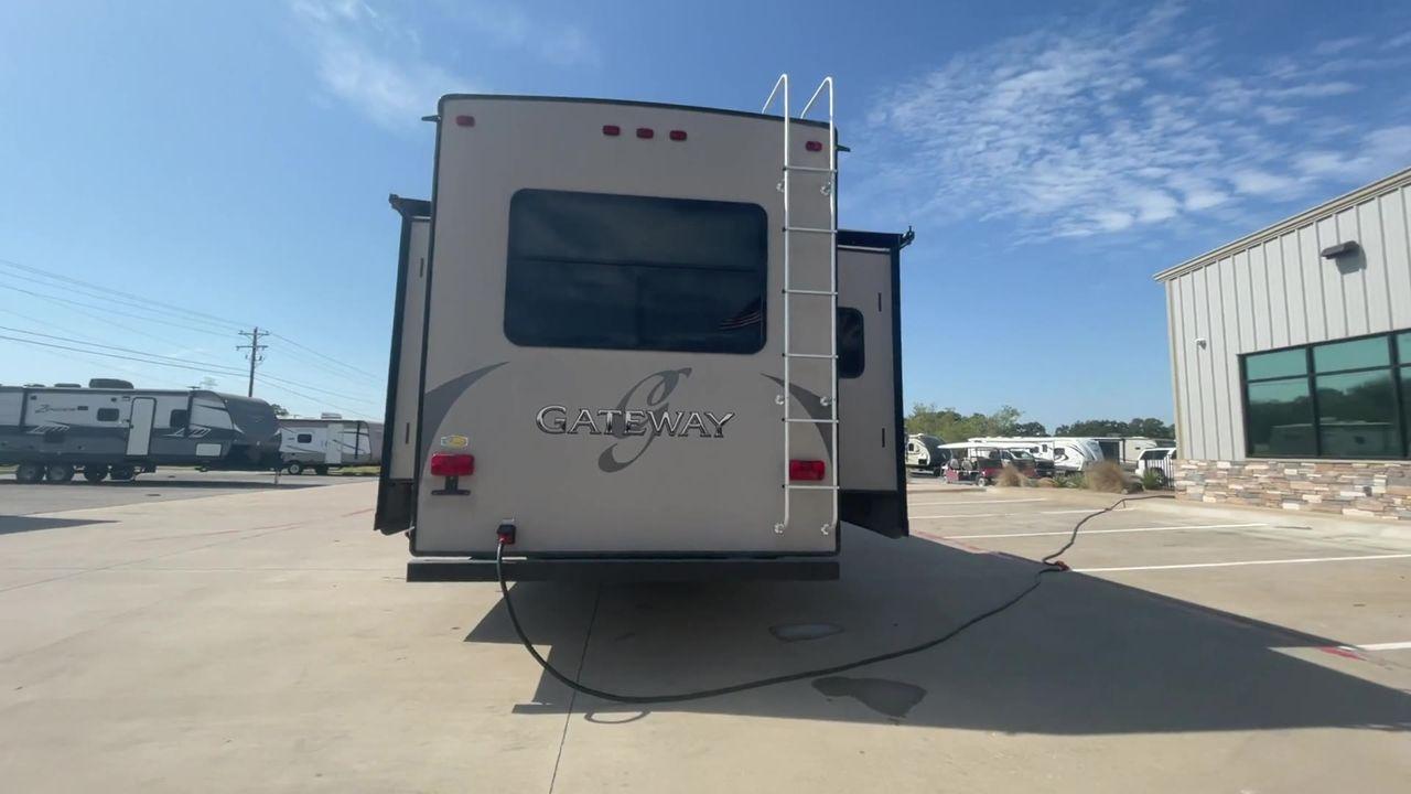 2015 BROWN HEARTLAND GATEWAY 3900SE (5SFSG4122FE) , Slides: 4 transmission, located at 4319 N Main St, Cleburne, TX, 76033, (817) 678-5133, 32.385960, -97.391212 - The 2015 Heartland Gateway 3900SE is a luxurious and spacious fifth-wheel RV designed for comfort and extended camping adventures. Measuring 41 feet in length and 8 feet in width, this RV offers ample space and a striking exterior. Constructed with a strong and lightweight aluminum frame, and fiberg - Photo #8