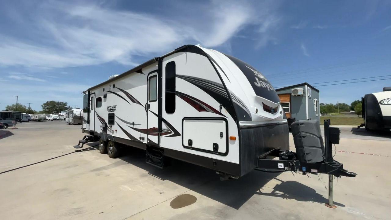2017 WHITE JAYCO WHITE HAWK 30RDS - (1UJBJ0BS3H1) , Length: 35.25 ft. | Dry Weight: 6,620 lbs | Gross Weight: 8,500 | Slides: 1 transmission, located at 4319 N Main St, Cleburne, TX, 76033, (817) 678-5133, 32.385960, -97.391212 - The 2017 Jayco White Hawk 30RDS is a versatile and well-crafted travel trailer, measuring 35 feet in length and boasting a dry weight of 6,620 lbs with a GVWR of 8,500 lbs. Designed to accommodate 4-6 people, this trailer features an I-Class structural I-beam frame and vacuum-bonded laminated fiberg - Photo #3