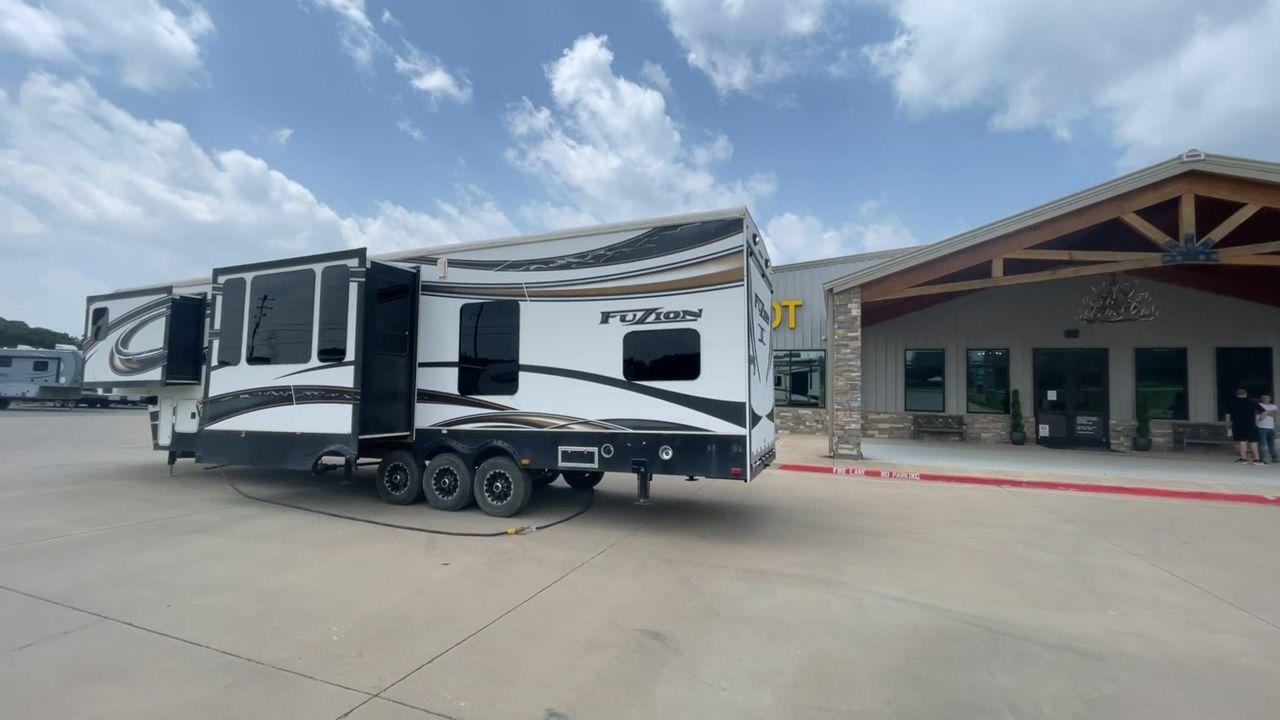 2014 WHITE KEYSTONE FUZION M-399 (4YDF39939EF) , Length: 41 ft. | Dry Weight: 14,100 lbs. | Gross Weight: 18,000 lbs. | Slides: 3 transmission, located at 4319 N Main St, Cleburne, TX, 76033, (817) 678-5133, 32.385960, -97.391212 - The 2014 Keystone Fuzion M-399 offers exceptional value for its price. With its white exterior color, this RV stands out on the road and is sure to turn heads wherever you go. Measuring 41 ft. in length, this toy hauler provides ample space for you and your loved ones to relax and enjoy your travels - Photo #7