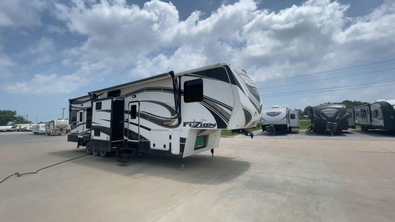 2014 WHITE KEYSTONE FUZION M-399 (4YDF39939EF) , Length: 41 ft. | Dry Weight: 14,100 lbs. | Gross Weight: 18,000 lbs. | Slides: 3 transmission, located at 4319 N Main Street, Cleburne, TX, 76033, (817) 221-0660, 32.435829, -97.384178 - The 2014 Keystone Fuzion M-399 offers exceptional value for its price. With its white exterior color, this RV stands out on the road and is sure to turn heads wherever you go. Measuring 41 ft. in length, this toy hauler provides ample space for you and your loved ones to relax and enjoy your travels - Photo #3