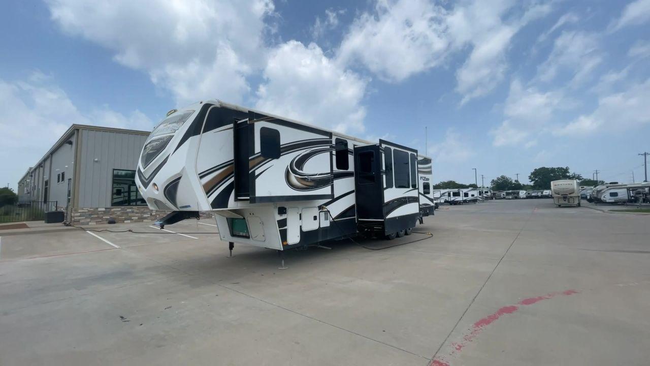 2014 WHITE KEYSTONE FUZION M-399 (4YDF39939EF) , Length: 41 ft. | Dry Weight: 14,100 lbs. | Gross Weight: 18,000 lbs. | Slides: 3 transmission, located at 4319 N Main Street, Cleburne, TX, 76033, (817) 221-0660, 32.435829, -97.384178 - The 2014 Keystone Fuzion M-399 offers exceptional value for its price. With its white exterior color, this RV stands out on the road and is sure to turn heads wherever you go. Measuring 41 ft. in length, this toy hauler provides ample space for you and your loved ones to relax and enjoy your travels - Photo #5