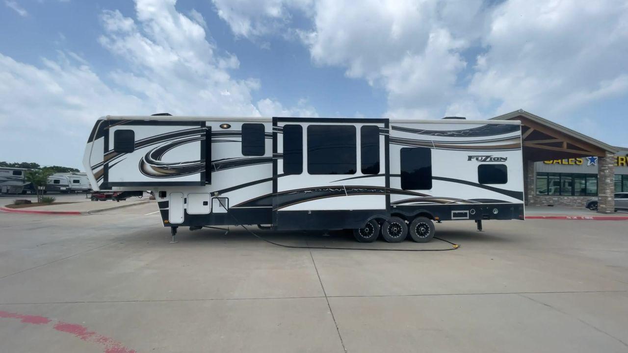 2014 WHITE KEYSTONE FUZION M-399 (4YDF39939EF) , Length: 41 ft. | Dry Weight: 14,100 lbs. | Gross Weight: 18,000 lbs. | Slides: 3 transmission, located at 4319 N Main Street, Cleburne, TX, 76033, (817) 221-0660, 32.435829, -97.384178 - The 2014 Keystone Fuzion M-399 offers exceptional value for its price. With its white exterior color, this RV stands out on the road and is sure to turn heads wherever you go. Measuring 41 ft. in length, this toy hauler provides ample space for you and your loved ones to relax and enjoy your travels - Photo #6