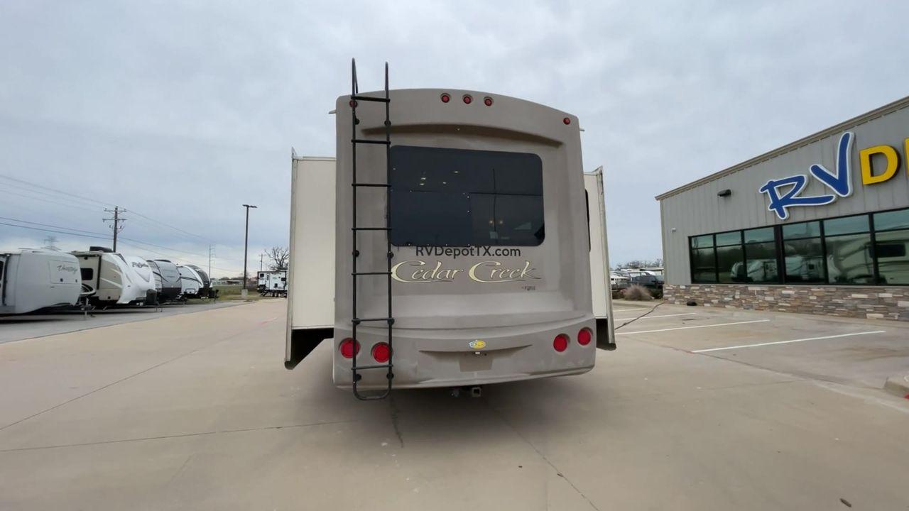 2014 TAN FOREST RIVER CEDAR CREEK 36CKTS (4X4FCRM26ES) , Length: 39.92 ft. | Dry Weight: 12,076 lbs. | Gross Weight: 16,389 lbs. | Slides: 3 transmission, located at 4319 N Main St, Cleburne, TX, 76033, (817) 678-5133, 32.385960, -97.391212 - This 2014 Forest River Cedar Creek 36CKTS Fifth Wheel measures just shy of 40 feet long and 8 feet wide. This model has a GVWR of 16,389 and a hitch weight of 2,389 lbs. This unit is equipped with heating rated at 40,000 BTUs, and cooling rated at 15,000 BTUs, meaning it will always be exactly the t - Photo #8