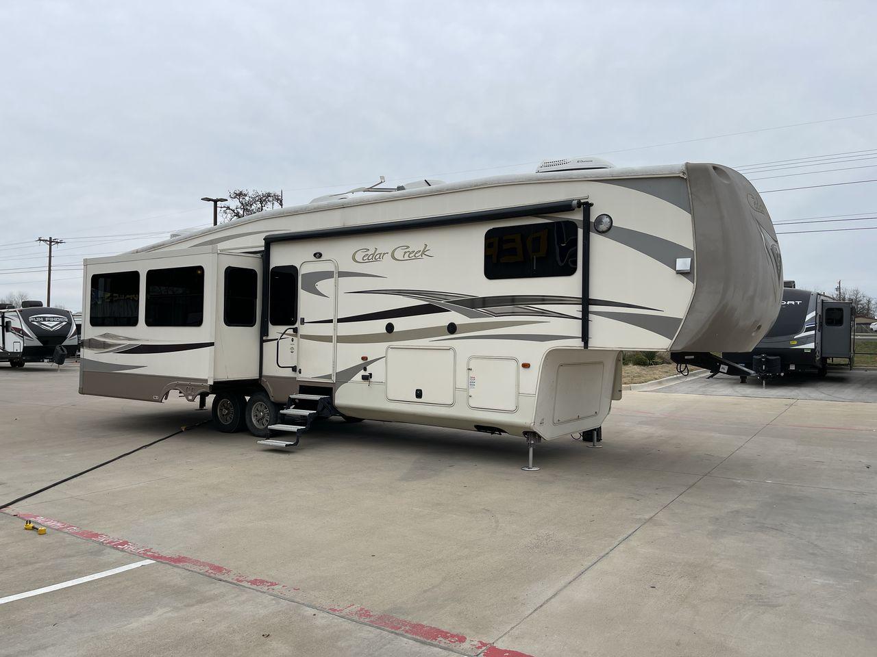 2014 TAN FOREST RIVER CEDAR CREEK 36CKTS (4X4FCRM26ES) , Length: 39.92 ft. | Dry Weight: 12,076 lbs. | Gross Weight: 16,389 lbs. | Slides: 3 transmission, located at 4319 N Main St, Cleburne, TX, 76033, (817) 678-5133, 32.385960, -97.391212 - This 2014 Forest River Cedar Creek 36CKTS Fifth Wheel measures just shy of 40 feet long and 8 feet wide. This model has a GVWR of 16,389 and a hitch weight of 2,389 lbs. This unit is equipped with heating rated at 40,000 BTUs, and cooling rated at 15,000 BTUs, meaning it will always be exactly the t - Photo #24