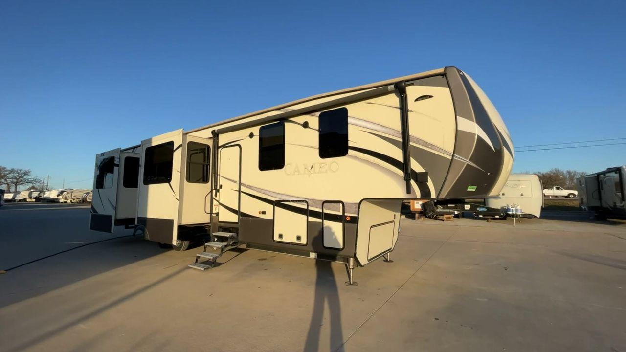 2017 TAN CAMEO 3701RD (4V0FC3727HR) , Length: 42.08 ft. | Dry Weight: 13,848 lbs. | Gross Weight: 16,678 lbs. | Slides: 5 transmission, located at 4319 N Main Street, Cleburne, TX, 76033, (817) 221-0660, 32.435829, -97.384178 - At 42.08 feet in length and boasting five slideouts, the Cameo 3701RD is a masterclass in RV luxury that beckons you to embark on a journey where every mile is marked by comfort, style, and unparalleled sophistication. Crafted by CrossRoads RV, the Cameo series is celebrated for its unparalleled cra - Photo #3
