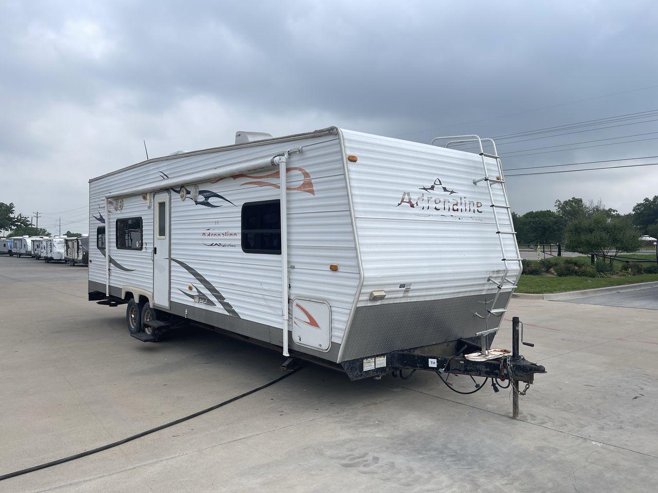 2008 WHITE ADRENALINE 23FS (1TC2B180683) , Length: 28.67 ft | Dry Weight: 6,474 lbs | Gross Weight: 9,500 lbs | Slides: 9 transmission, located at 4319 N Main Street, Cleburne, TX, 76033, (817) 221-0660, 32.435829, -97.384178 - The 2008 Adrenaline 23FS Toy Hauler is prepared for a journey! It is 28.67 feet long and weighs 6,474 pounds when dry. It's lightweight and portable, but large enough to hold all of your favorite toys and accessories. It can accommodate up to 9,500 pounds, so you'll have plenty of room for your next - Photo #23