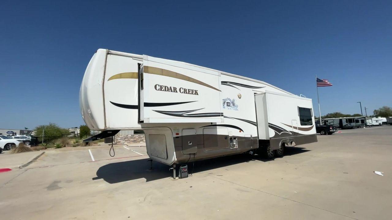 2011 WHITE CEDAR CREEK 36RE - (4X4FCRM24BS) , Length: 39 ft. | Dry Weight: 12,095 lbs. | Gross Weight: 15,500 lbs. | Slides: 3 transmission, located at 4319 N Main Street, Cleburne, TX, 76033, (817) 221-0660, 32.435829, -97.384178 - The 2011 Forest River Cedar Creek 36RE is a spacious and meticulously designed fifth-wheel RV, measuring 39 feet in length and 8 feet in width. With a dry weight of 12,095 lbs and a substantial GVWR of 15,500 lbs, this RV strikes a balance between size and towing efficiency. The aluminum superstruct - Photo #5