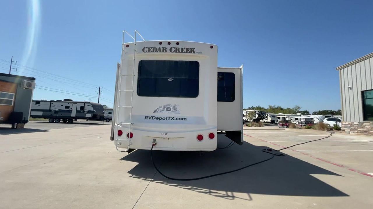 2011 WHITE CEDAR CREEK 36RE - (4X4FCRM24BS) , Length: 39 ft. | Dry Weight: 12,095 lbs. | Gross Weight: 15,500 lbs. | Slides: 3 transmission, located at 4319 N Main Street, Cleburne, TX, 76033, (817) 221-0660, 32.435829, -97.384178 - The 2011 Forest River Cedar Creek 36RE is a spacious and meticulously designed fifth-wheel RV, measuring 39 feet in length and 8 feet in width. With a dry weight of 12,095 lbs and a substantial GVWR of 15,500 lbs, this RV strikes a balance between size and towing efficiency. The aluminum superstruct - Photo #8