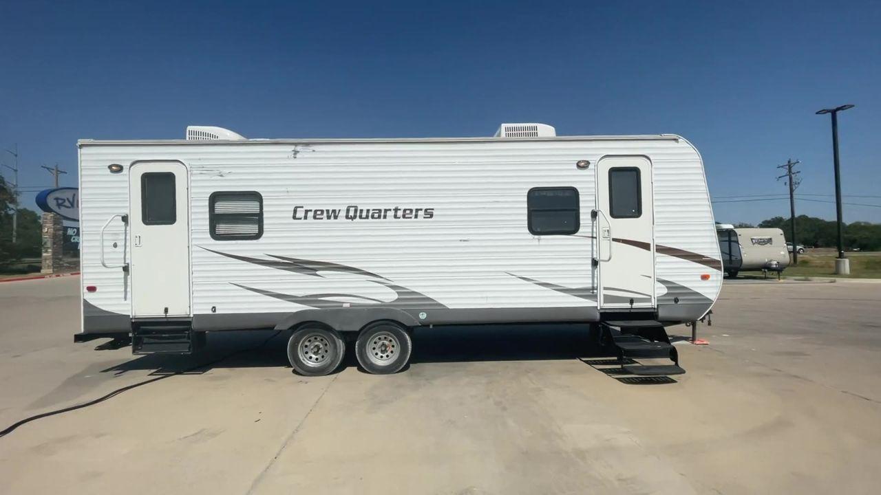 2010 WHITE FOREST RIVER CREW QUARTERS T24-2 - (4X4TWDZ21AR) , Dry Weight: 5,275 lbs | Gross Weight: 7,713 lbs | Slides: 0 transmission, located at 4319 N Main St, Cleburne, TX, 76033, (817) 678-5133, 32.385960, -97.391212 - The 2010 Crew Quarters T24-2 is a cute and cozy travel trailer that comes with lovely features that you would absolutely adore in a camper. It features a corner bunk bed with a nice window on the bottom bunk. It has a mini fridge, a microwave, and a solid surface counter space. A tall double-door ca - Photo #2
