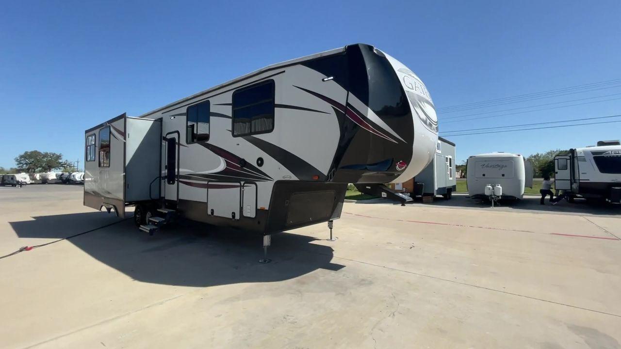 2017 TAN GATEWAY 3712RDMB - (5SFSG4228HE) , Length: 39.5 ft. | Dry Weight: 13,680 lbs. | Gross Weight: 15,500 lbs. | Slides: 4 transmission, located at 4319 N Main Street, Cleburne, TX, 76033, (817) 221-0660, 32.435829, -97.384178 - Explore more reasons that emphasize the benefits of having this RV as your own. (1) It has Two TVs for entertainment in both the living area and the master bedroom. (2) It has Outside speakers bring the music outdoors for alfresco enjoyment. (3) It has a sleek and durable solid surface counter - Photo #5