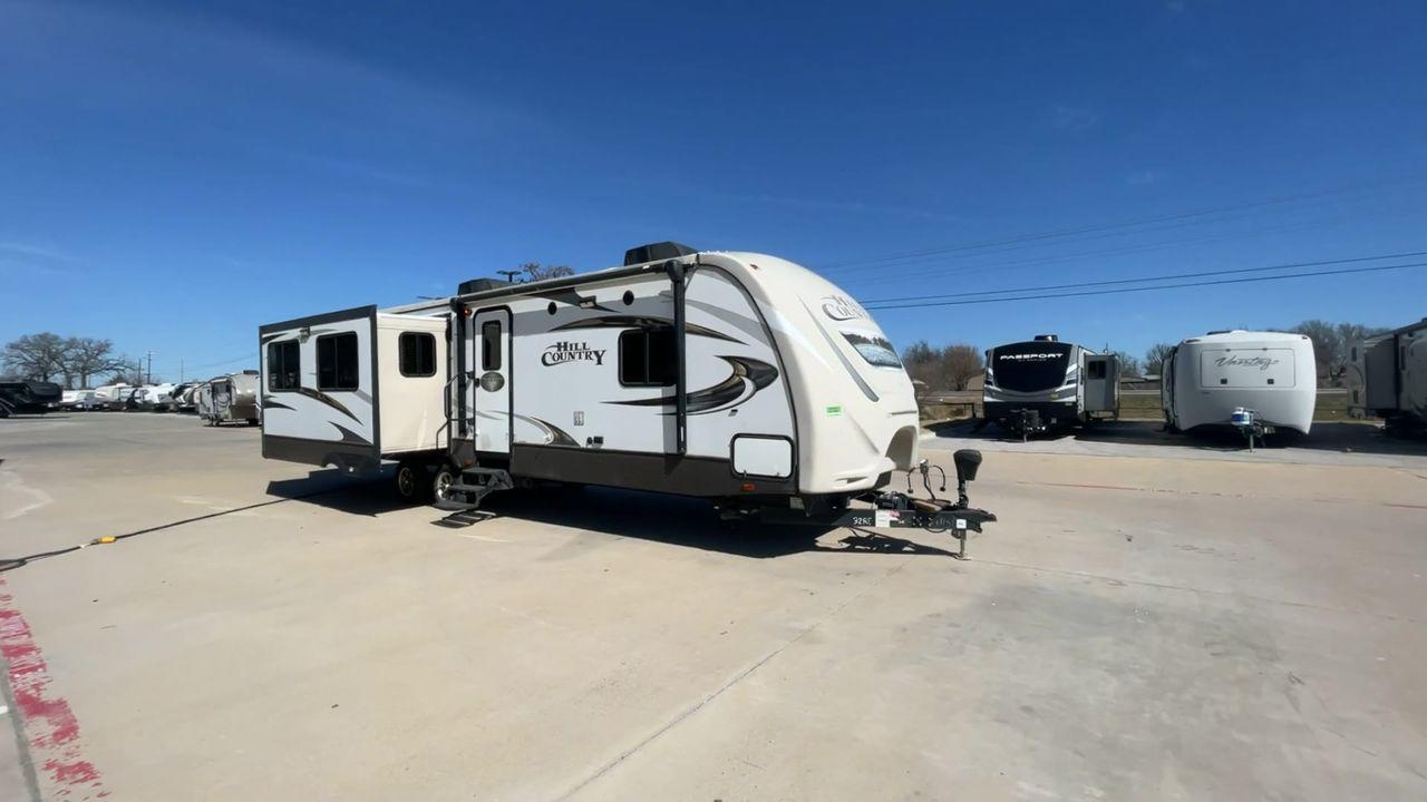 2016 CROSSROADS HILL COUNTRY - (4V0TC3220GE) , Slides: 3 transmission, located at 4319 N Main St, Cleburne, TX, 76033, (817) 678-5133, 32.385960, -97.391212 - The 2016 Crossroads Hill Country is a versatile and compact travel trailer designed to elevate your camping experience. This unit provides a comfortable and efficient living space for your adventures. Its thoughtfully designed interiors provide a welcoming and cozy atmosphere. The Hill Country featu - Photo #3